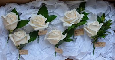 White rose buttonholes
